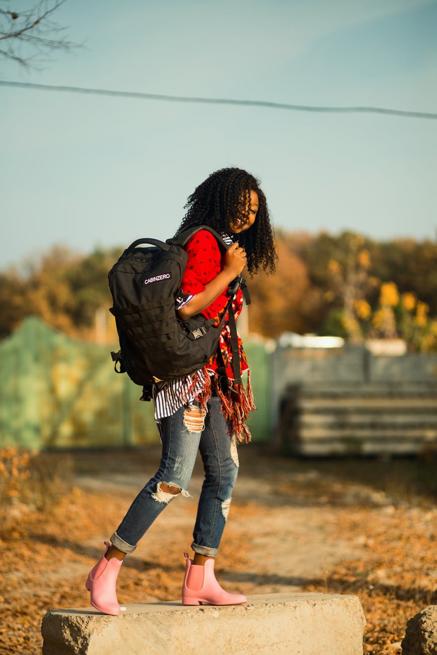 woman carrying backpack